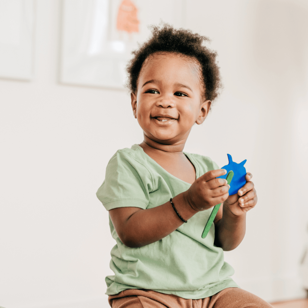 Toddler boy clapping