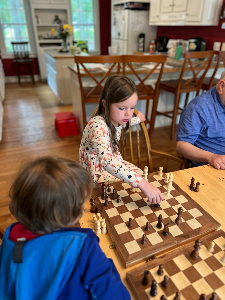 Kids playing chess during homeschool enrichment