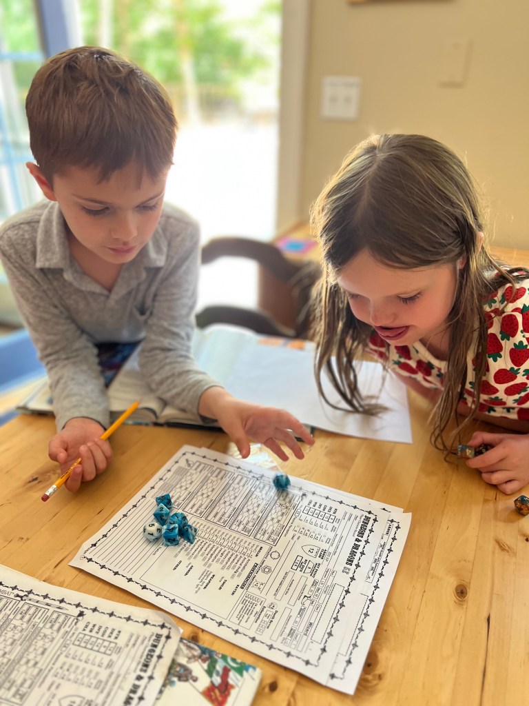 Kids playing dungeons and dragons during homeschool enrichment